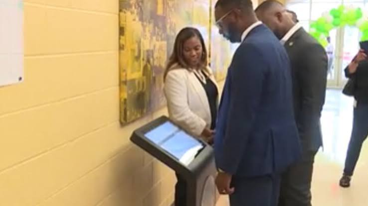 Visitors viewing a digital kiosk at the launch.